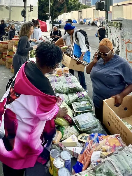 Aerial view of volunteers and community members at a Soul Saving Productions event