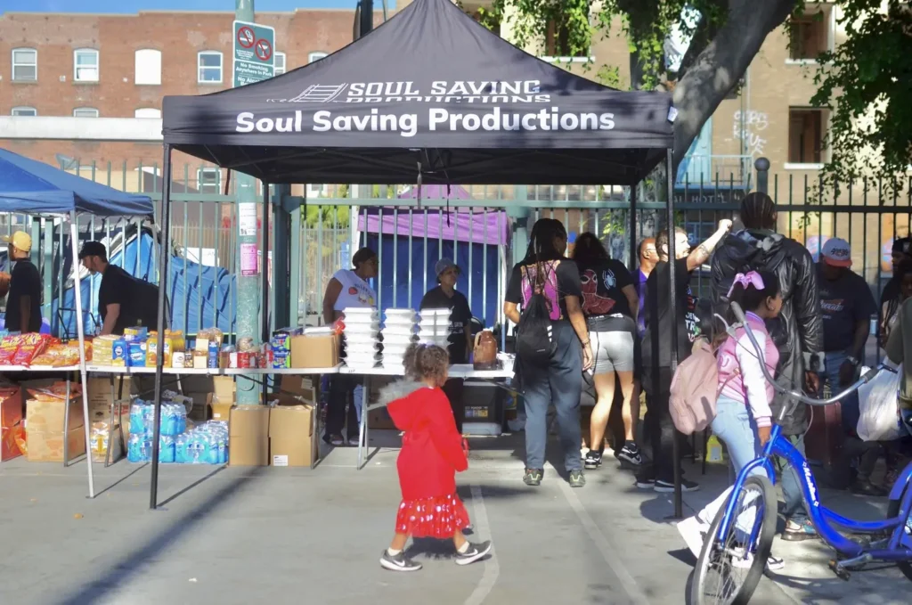 Volunteers preparing hot meals for distribution during street outreach