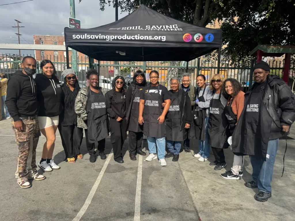 Soul Saving Productions volunteers organizing donated clothing and supplies